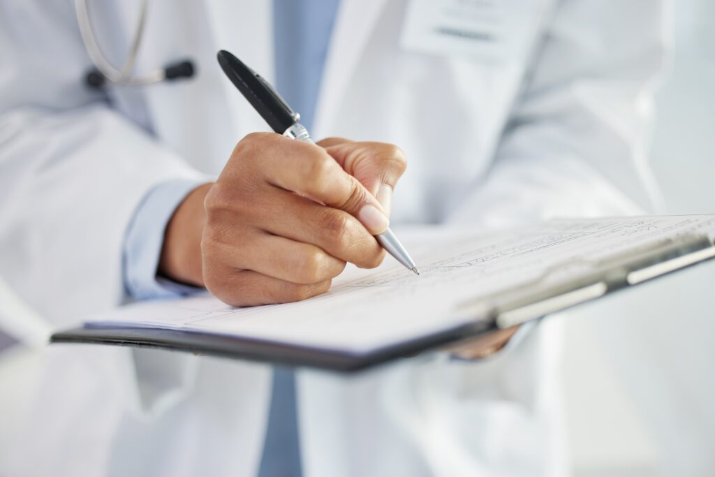 Doctor reviewing medical records related to a delayed diagnosis case in New Mexico.