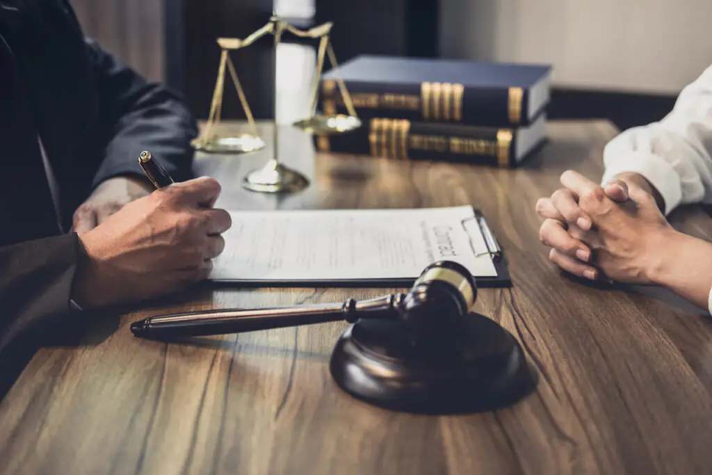 Breach of fiduciary duty lawyer in Las Cruces reviewing financial misconduct case documents.